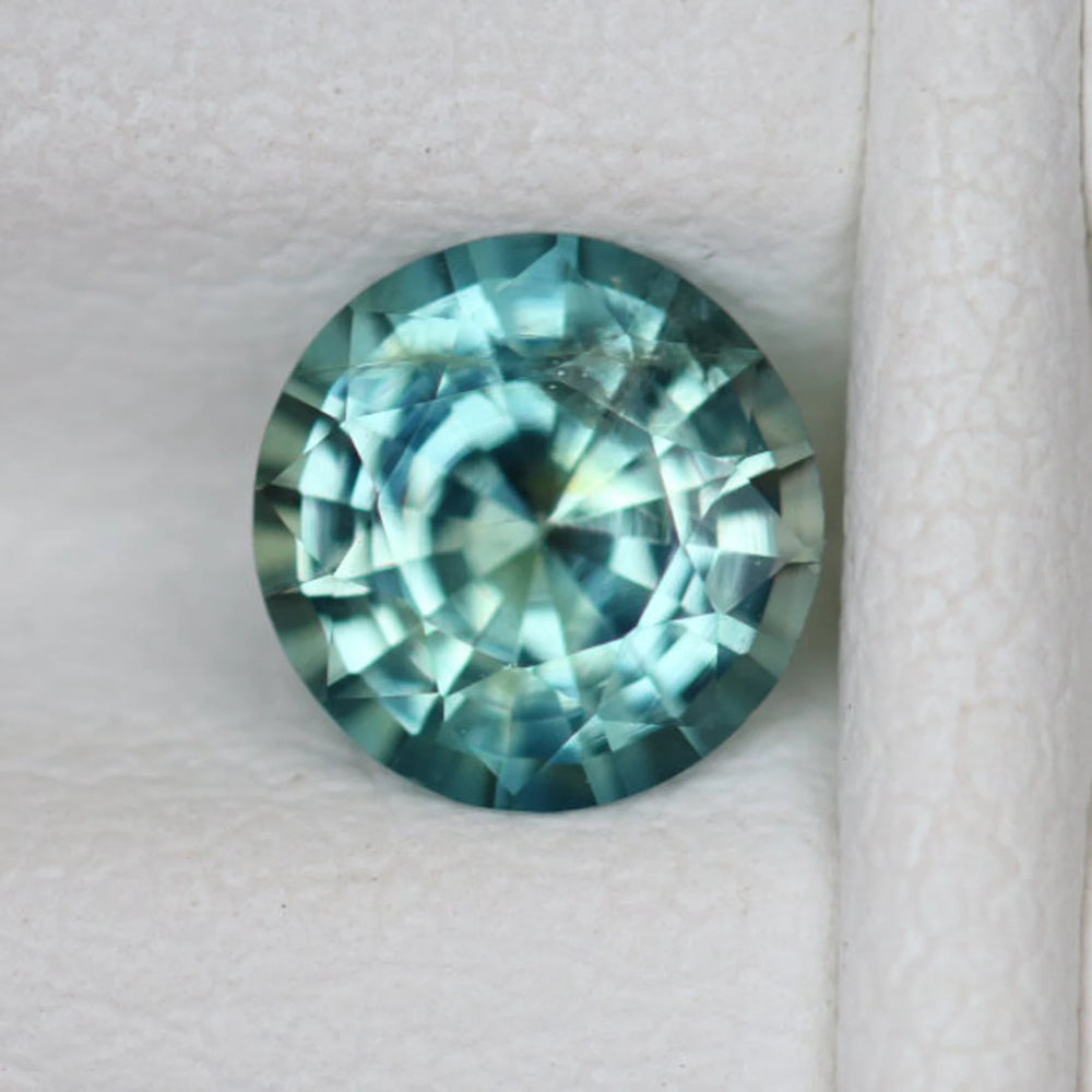 0.97 Ct Round Cut Bi-Color Teal Green Sapphire, 6.1mm x 6.0mm x 3.7mm By Valley Rose