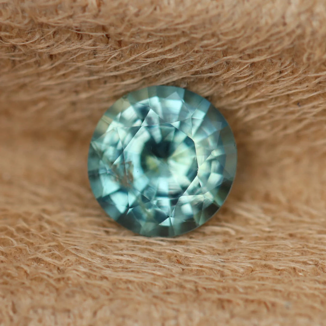 0.97 Ct Round Cut Bi-Color Teal Green Sapphire, 6.1mm x 6.0mm x 3.7mm By Valley Rose