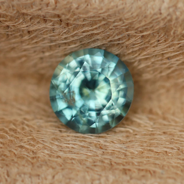 0.97 Ct Round Cut Bi-Color Teal Green Sapphire, 6.1mm x 6.0mm x 3.7mm By Valley Rose