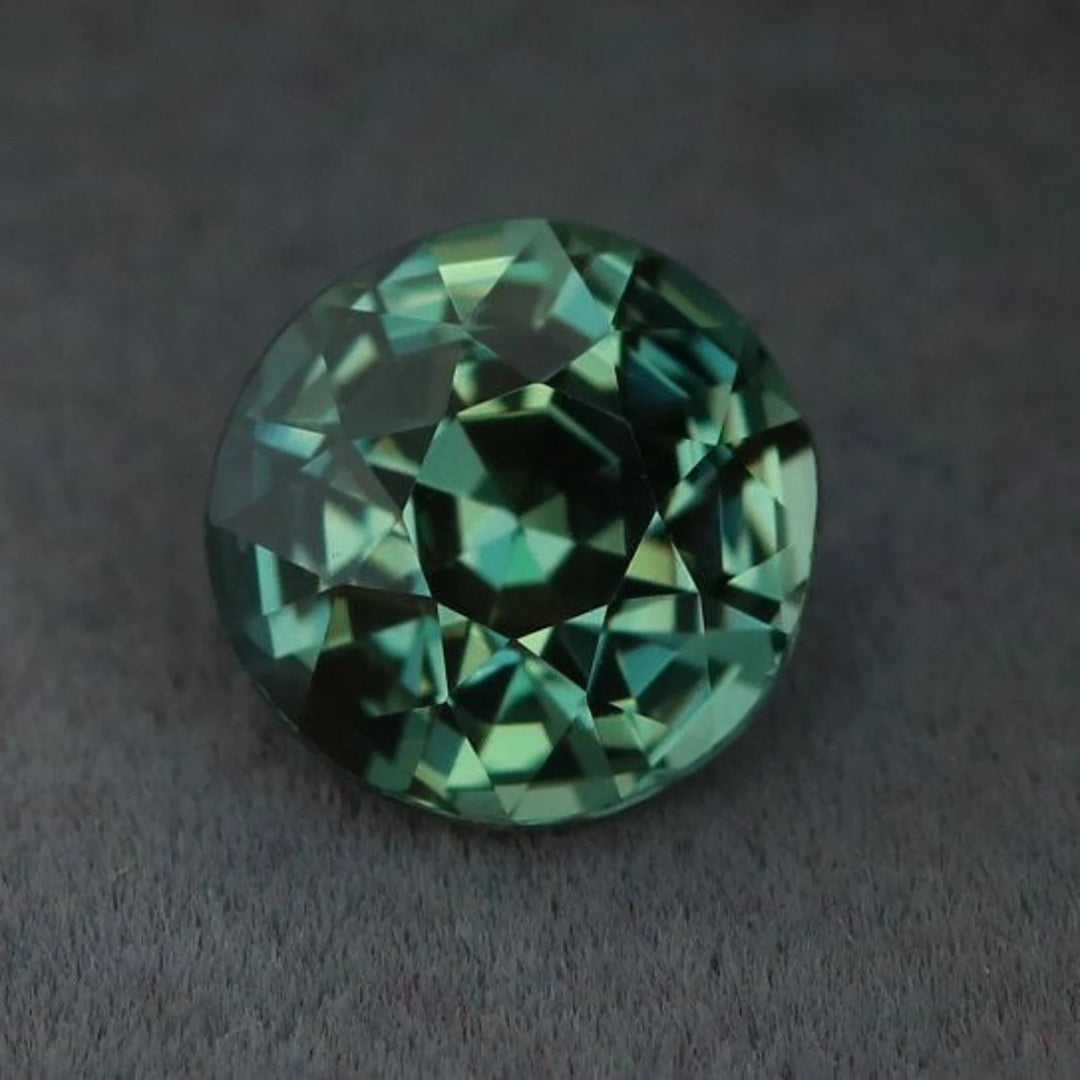 1.08 Ct Round Cut Bi-Color Teal Green Sapphire, 5.8mm x 5.8mm x 4.2mm By Valley Rose