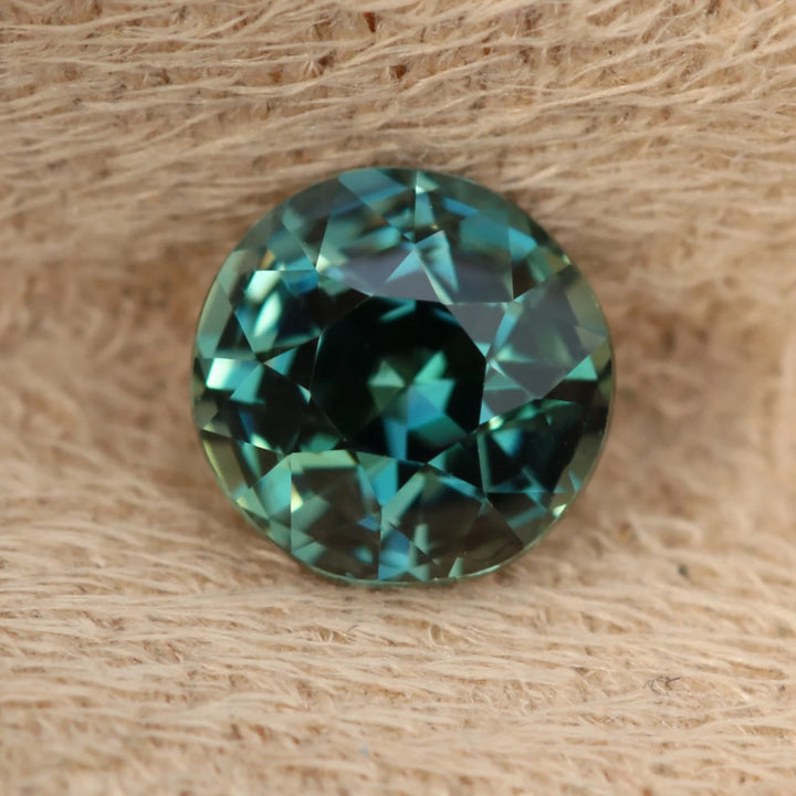 1.08 Ct Round Cut Bi-Color Teal Green Sapphire, 5.8mm x 5.8mm x 4.2mm By Valley Rose