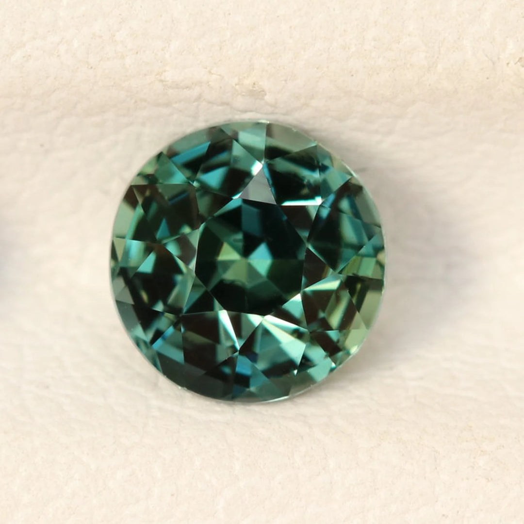 1.08 Ct Round Cut Bi-Color Teal Green Sapphire, 5.8mm x 5.8mm x 4.2mm By Valley Rose
