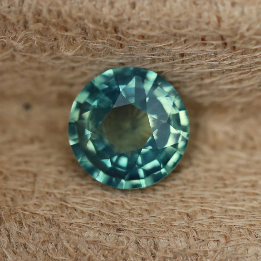 1.11 Ct Round Cut Bi-Color Teal Green Sapphire, 6.5mm x 6.5mm x 3.4mm By Valley Rose