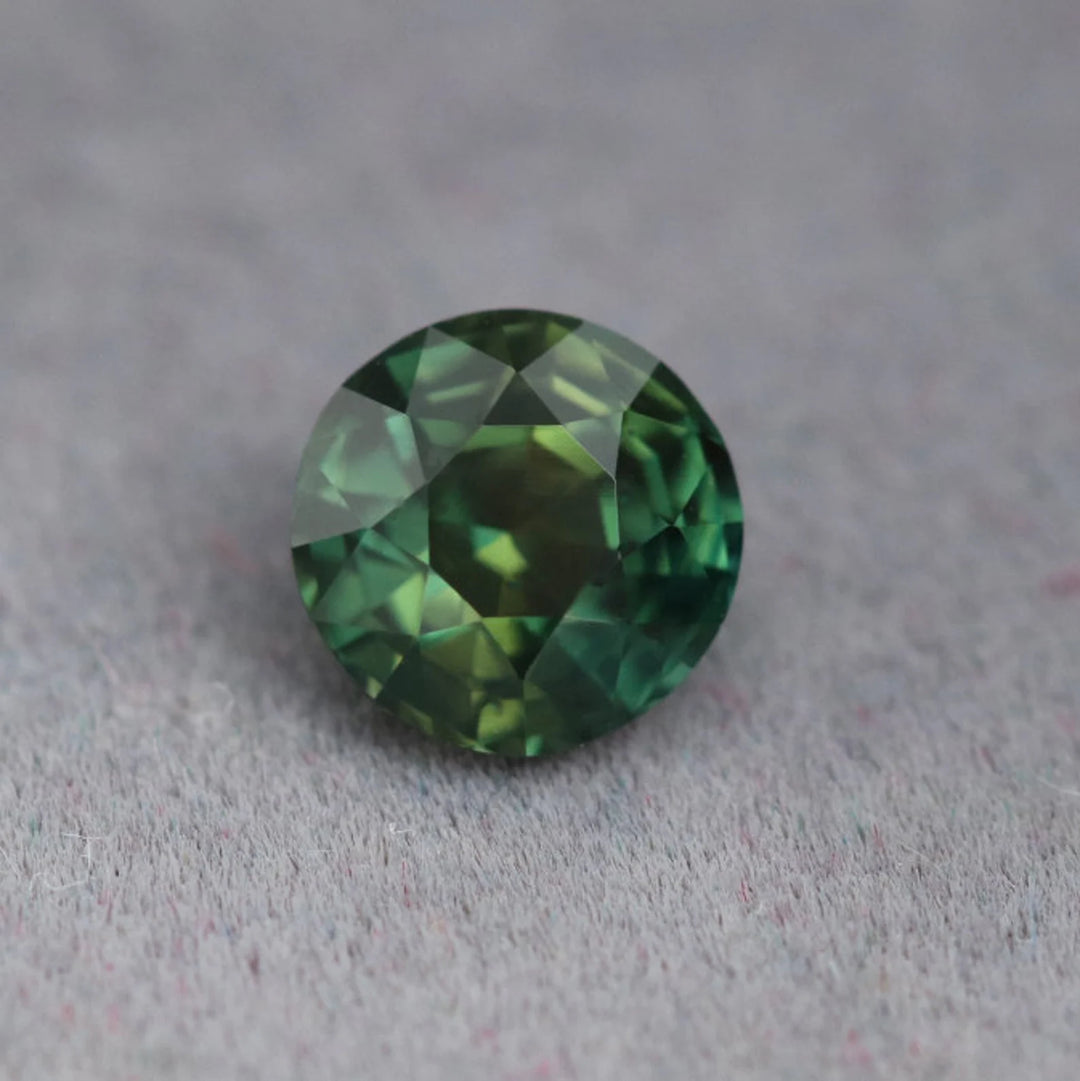 1.12 Ct Round Cut Bi-Color Teal Green Sapphire, 5.9mm x 5.9mm x 4.2mm By Valley Rose