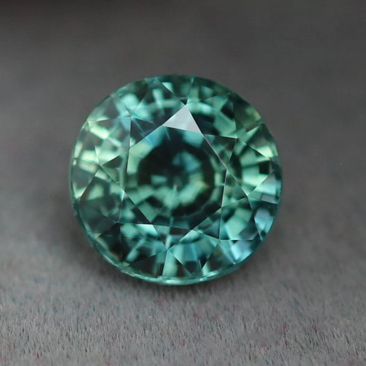 1.55 Ct Round Cut Bi-Color Teal Green Sapphire, 6.4mm x 6.4mm x 4.6mm By Valley Rose