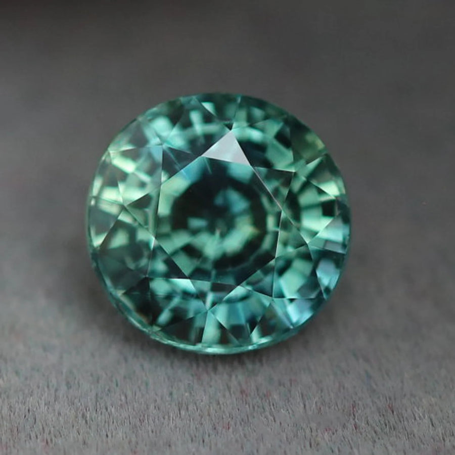 1.55 Ct Round Cut Bi-Color Teal Green Sapphire, 6.4mm x 6.4mm x 4.6mm By Valley Rose