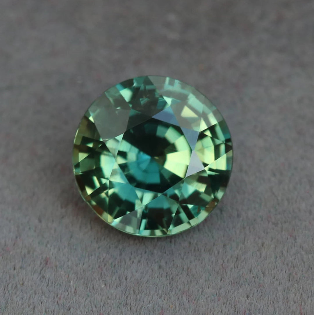 2.23 Ct Round Cut Bi-Color Teal Green Sapphire, 7.7mm x 7.7mm x 4.8mm By Valley Rose