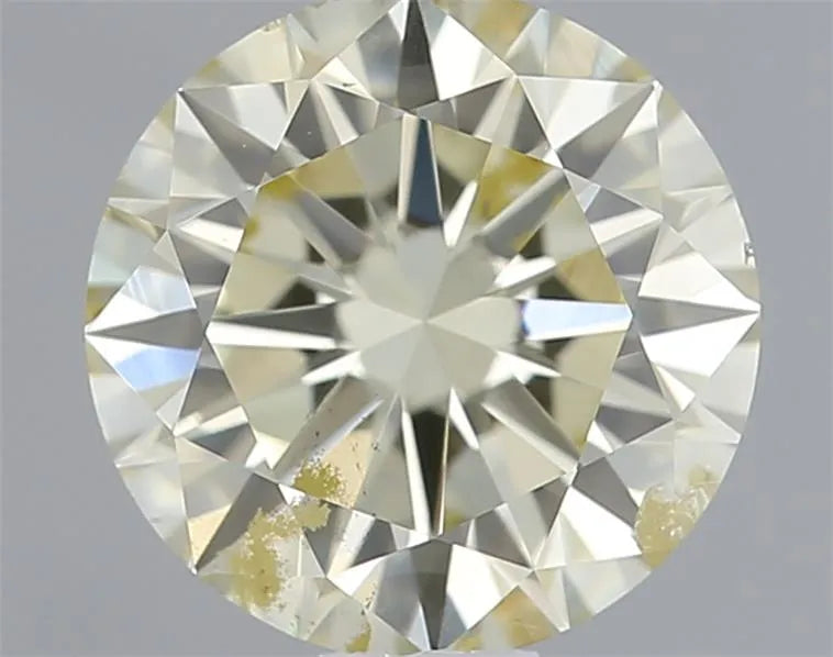 0.74ct Round Natural Diamond (Colour M, Clarity SI2, Cut EX, IGI Certified)