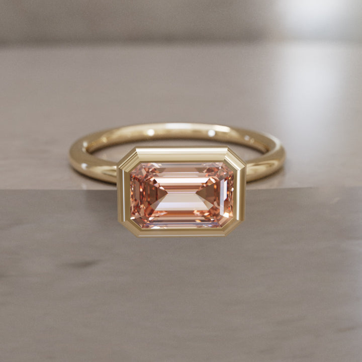 Indie East West Emerald Cut Peach Diamond Modern Unique Bezel Engagement Ring
