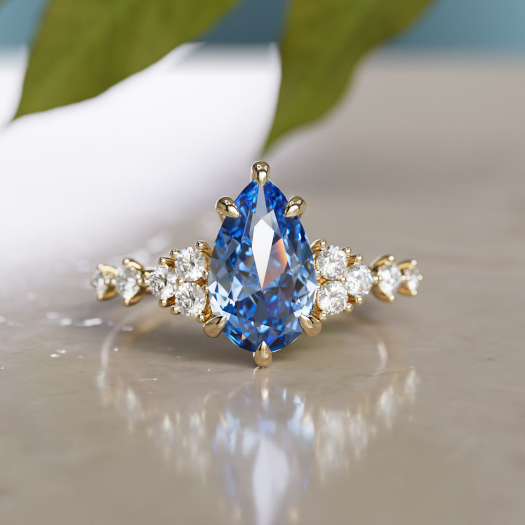 Anillo de compromiso único Olivia con zafiro azul en forma de pera, inspirado en la naturaleza