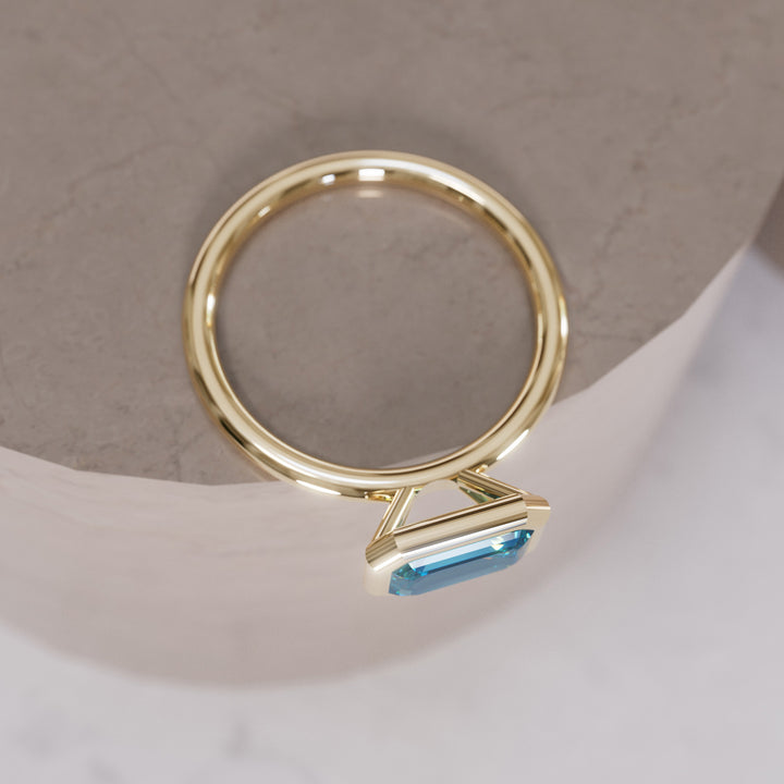 Unique Blue Sapphire Engagement Ring, Horizontal Emerald Cut Bezel Set By Valley Rose