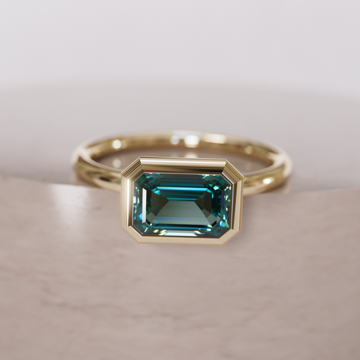 Unique Teal Sapphire Engagement Ring, Horizontal Emerald Cut Bezel Set By Valley Rose
