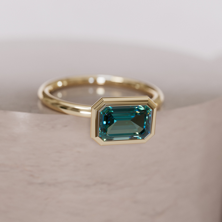 Unique Teal Sapphire Engagement Ring, Horizontal Emerald Cut Bezel Set By Valley Rose
